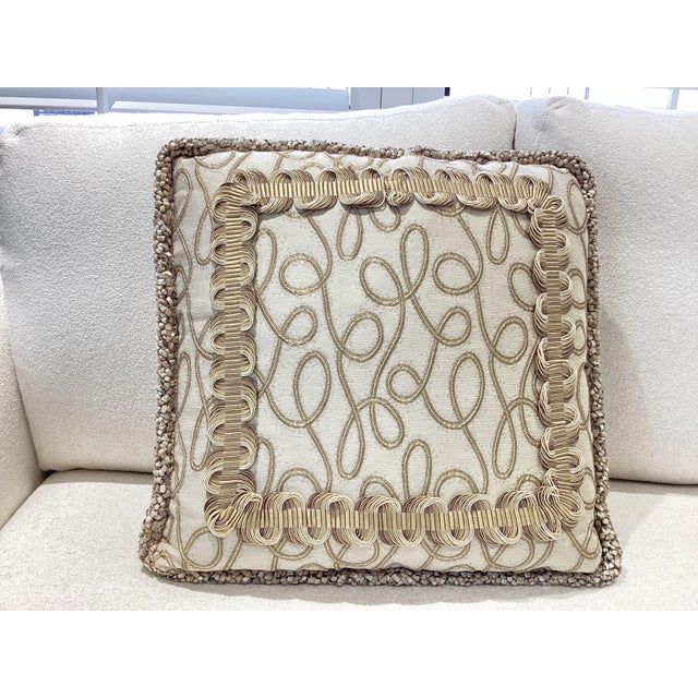 A sophisticated decorative throw pillow featuring a tonal, monochromatic palette of warm neutrals. Perfect for layered,...