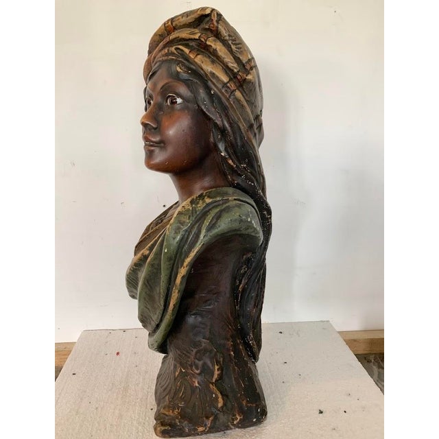 Attractive polychrome plaster bust Three-tone patina The eyes are made of sulfide Bears a mark and the number 68 bis Signs...