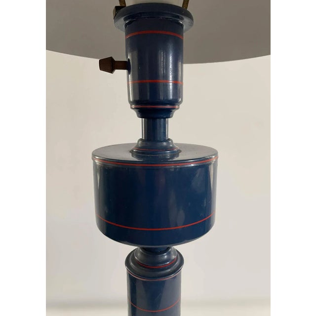 Vintage blue metal table lamp with dome shaped tin shade perforated on the top. Off white cord.