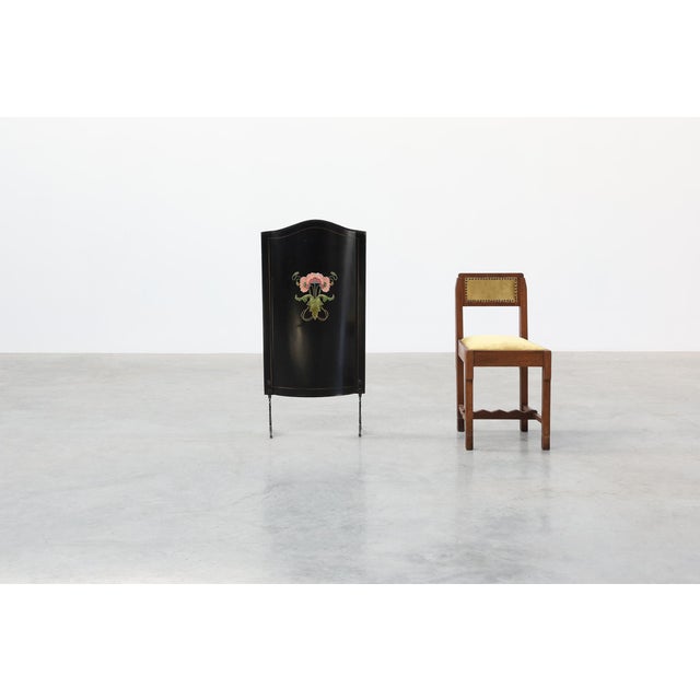 An elegant Art Nouveau fire screen from France, dating to around 1910, featuring a black lacquered panel with a...