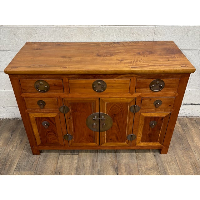 This is a gorgeous vintage, possibly antique, Chinese elm sideboard, buffet, credenza, in the Qing style. It features...
