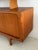 Classic Danish mid-century modern teak credenza with rounded corners and sliding doors; hutch with teak shelf and glass...