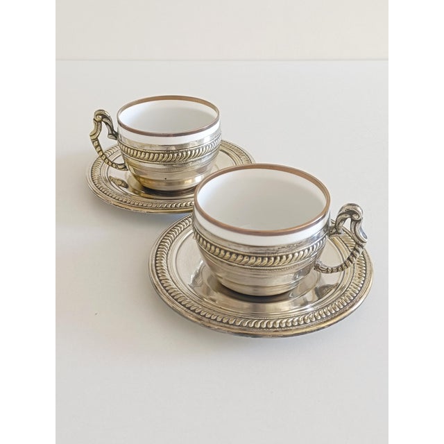 A gorgeous pair of Victorian mid 19th century alpaca silver and china tea or coffee cups and plates. Ideal to serve a...