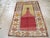 This early 20th century Turkish Anatolian rug, measuring 3' 5" x 4' 10", showcases the traditional prayer niche design...