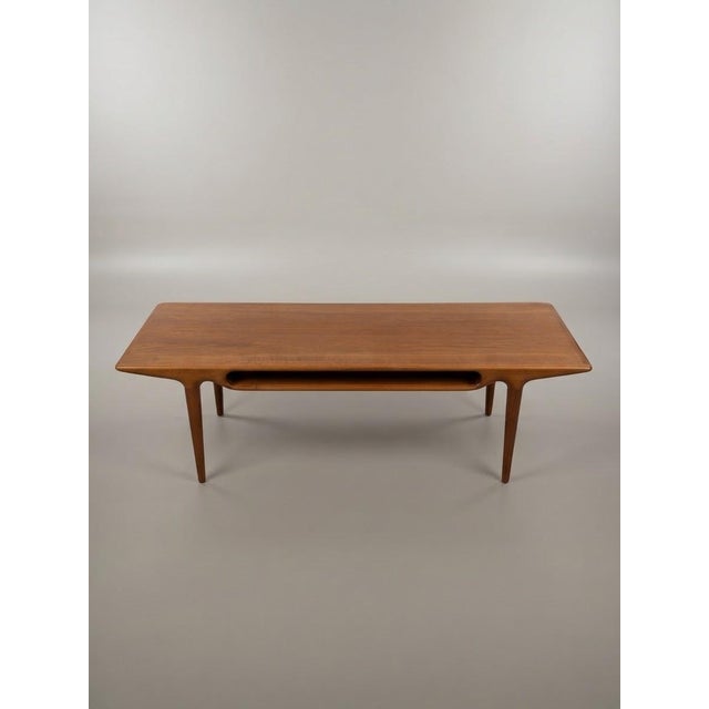This stunning coffee table is attributed to the iconic Johannes Andersen design, manufactured by CFC Silkeborg in Denmark...
