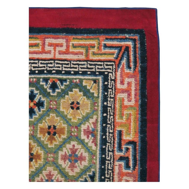 A vintage Tibetan throw rug handmade during the mid-20th century. Measures: 2' 10" x 4' 8".