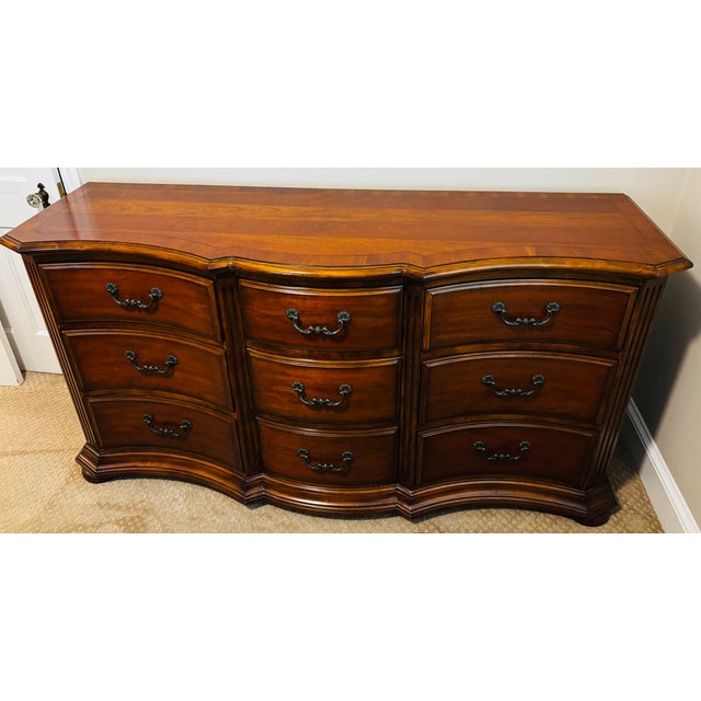 Make a statement with this serpentine dresser from the Ethan Allen Tuscany Collection. The gracefully curved front is a...