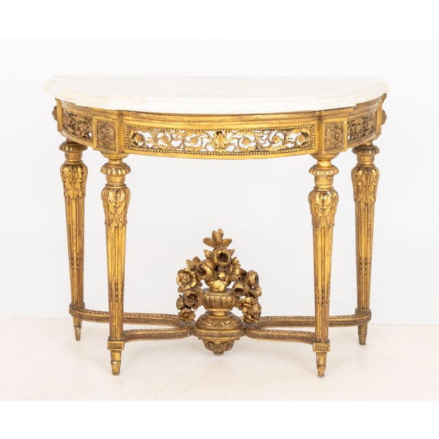 Northern Italian Quartz Top Giltwood Console Table, late 18th century, with pierced floral design on fluted tapered legs....