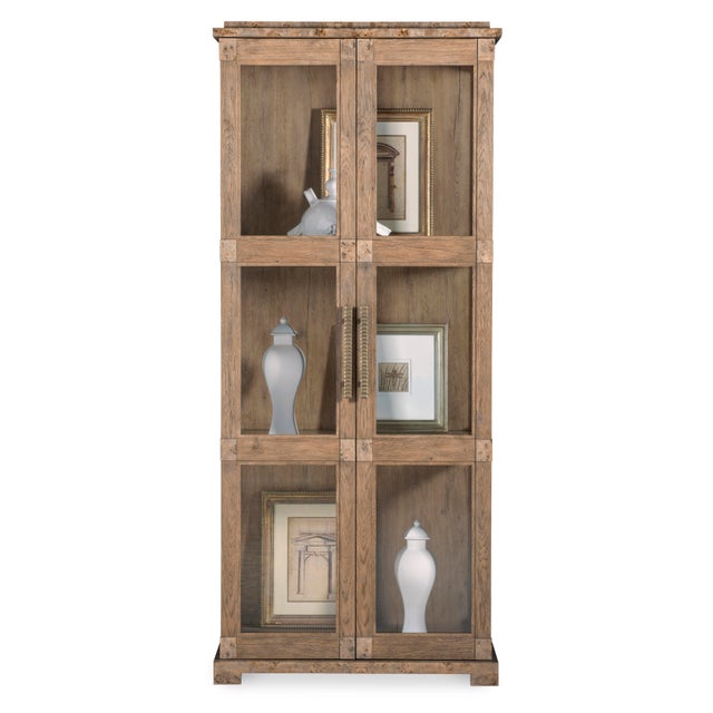 Behind two doors with aged bronze hardware pulls and glass inserts is five glass shelves and dimmable interior lighting...