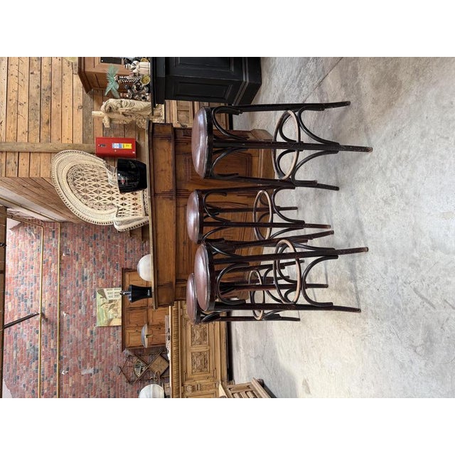 Set of 4 bentwood stools with faux leather seats. In good condition, with a beautiful patina from use. I have official...
