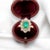 Pompadour ring worked in 18 carat gold (750 thousandths). It is decorated with an emerald of approximately 0.7 carat (6 x...