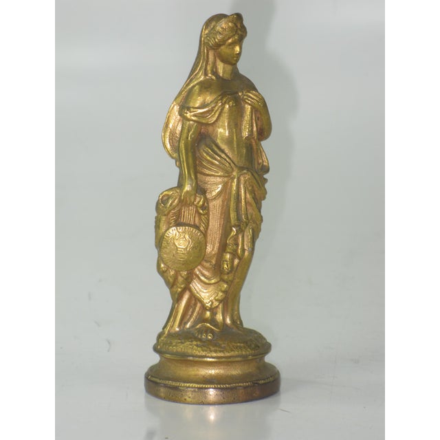 This is an Antique Neoclassical Gold Plated Spelter Gilded fine clock part statue sculpture from the USA, dating back to...