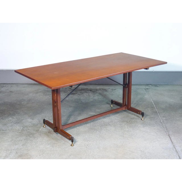 Italian design table from the 60s in wood. Origin italy period 1960s designer the line of the table refers to the italian...