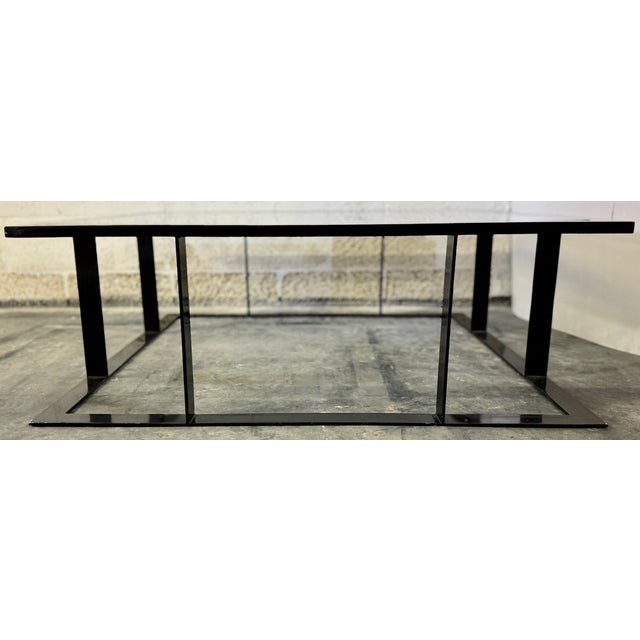 Sleek design and very good quality coffee table from 70's. Made of steel with a black finish coat and 0.5" glass top. Very...