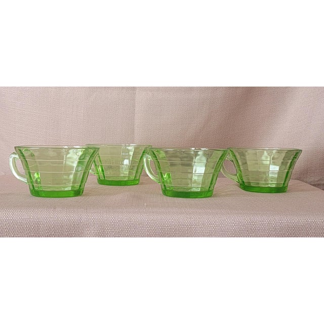 Set of 4 Transparent Green Uranium Glass Tea Cups In very nice condition. There is no gold on the rim of this set. No...