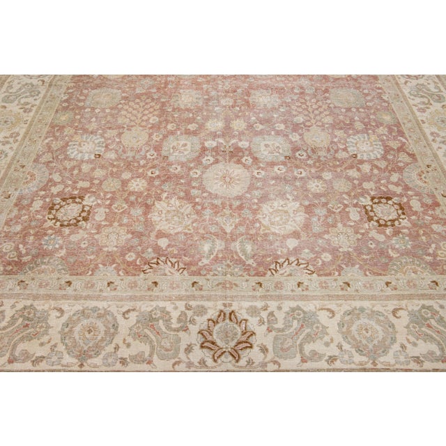 Beautiful antique Tabriz hand-knotted wool rug with a rust color field. This Persian rug has gray, green, and goldenrod...