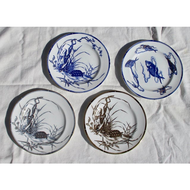 Four Royal Worcester handpainted and gilt serving dishes. Each a different study in Blue, Silver, Gold. Three of a turtle...