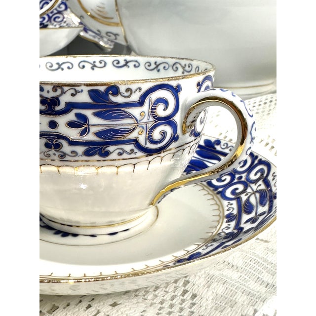 An exquisite, highly collectible late 19th-century 7-piece antique Austrian porcelain tea set manufactured by the renowned...