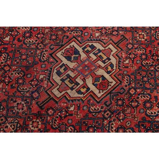 Beautiful vintage Persian Hamadan hand-knotted wool rug with a navy blue field. This piece has multicolor accents in an...