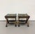 A theatrical pair of vintage curule-form stools crafted from dark-stained carved wood. Each features sculptural lion-head...