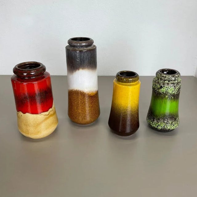Set of four fat lava art vases Producer: Scheurich, Germany Decade: 1970s These original vintage vases was produced in the...