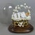 A rare and evocative devotional composition depicting the swaddled Baby Mary lying in a gilded cradle under a bell with a...