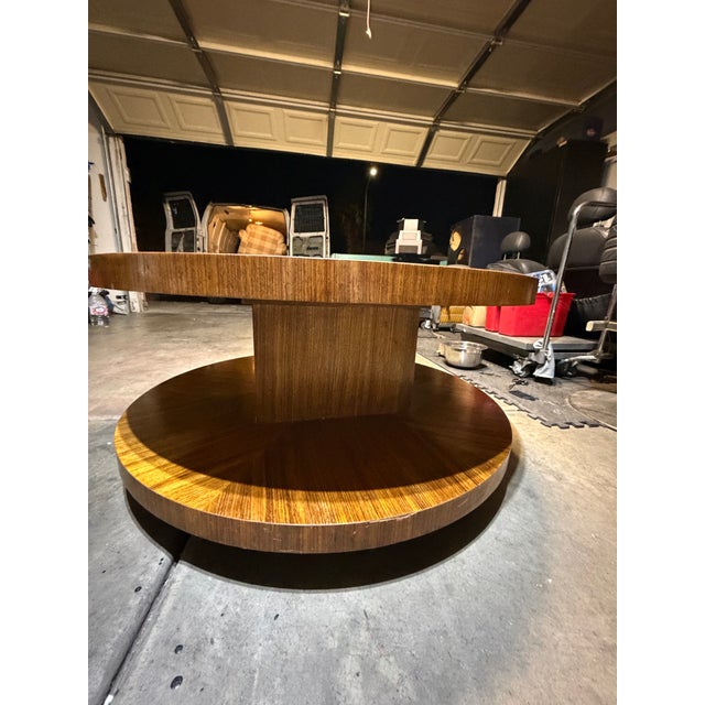 This table I own is a Mid-Century Modern style "lazy susan" coffee table with a tiered, rotating top and a distinctive...
