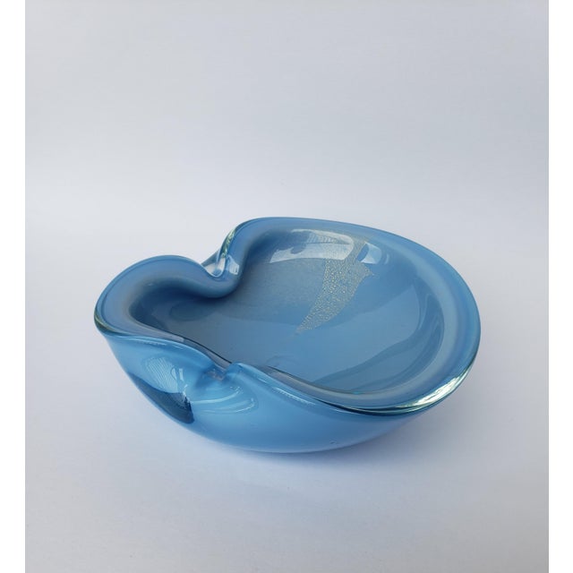 Lovely mid-century Murano glass bowl by Alfredo Barbini. Gorgeous blue with gold polveri encased by clear glass. This...