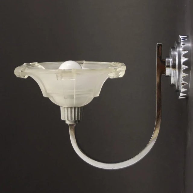 - Pair of wall lights made of solid nickel-plated brass - The original shades are in perfect conditiuon - Electricity...