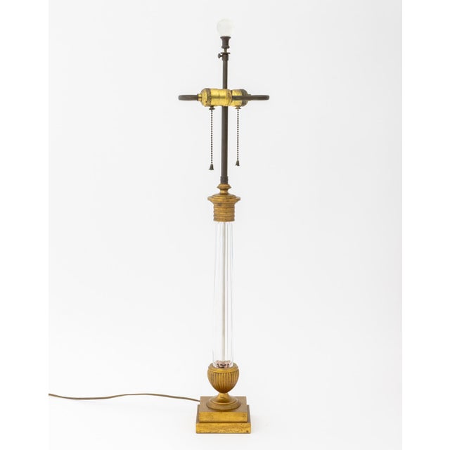 Neoclassical Style Gilt Metal Mounted Glass Table Lamp, the faceted glass column above a reeded urn form atop a stepped...