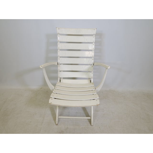 Adjustable "Riviera" lounger/garden chair by Triconfort with a wooden frame in a simple, minimalist design. The backrest...