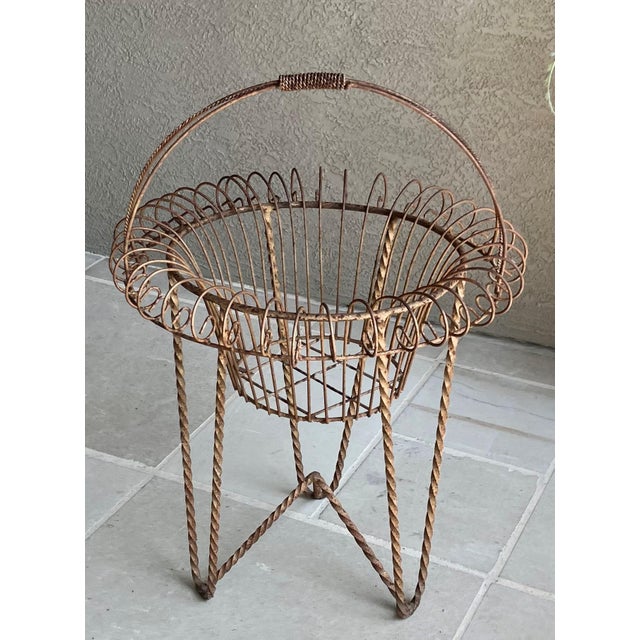 Excellent Pre-Owned Condition. Note: Faux florals are not included. Adorned with a beautiful rusty patina, this fabulous...
