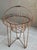 Excellent Pre-Owned Condition. Note: Faux florals are not included. Adorned with a beautiful rusty patina, this fabulous...