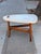 A vintage occasional table in the style of Harvey Probber, estimated mid-20th century. The biomorphic terrazzo top, inset...