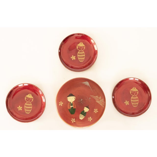 Lovely Japanese Lacquered red and hand painted wood set of 5 coasters in box. Hand made and hand painted. Worn mark...