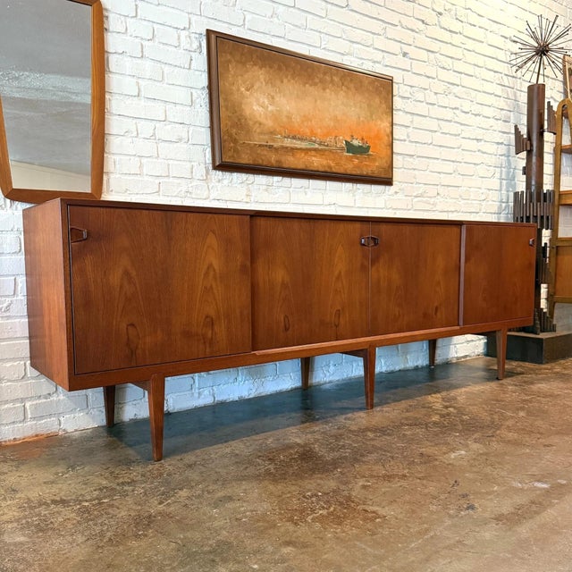 Exceptionally-rare vintage mid-century Danish modern Model 49 credenza in teak designed by Henry Rosengren Hansen for...