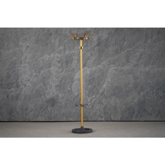 A striking and rare 1950s coat stand designed by renowned French modernist Jacques Adnet. This sculptural piece reflects...