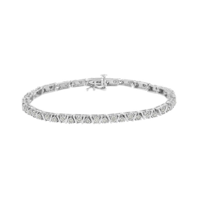 This lovely sterling silver bracelet shines with 1 carat TDW of diamonds and secures with a box with clasp. Sterling...