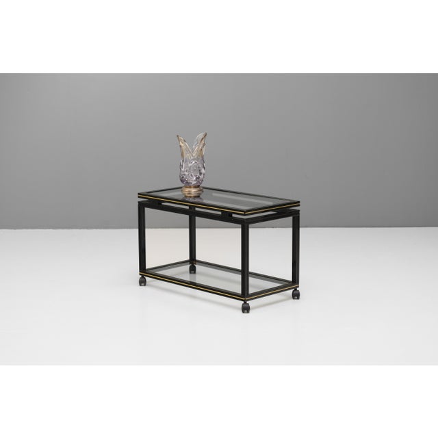 Two tier drinks trolley in black by Pierre Vandel. France circa 1970. This piece has an attribution mark, I am sure that...