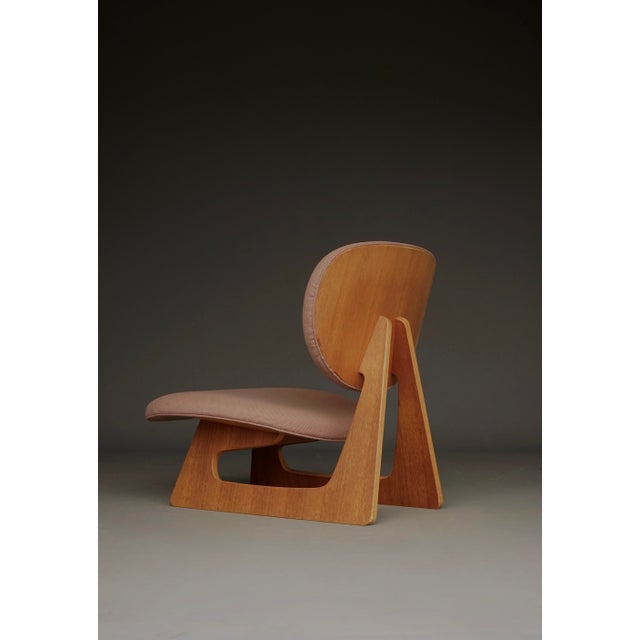 Tendo, Japan. Circa 1970s. (makers label to back). Veneered plywood with original upholstery. A scarce (outside of Japan)...