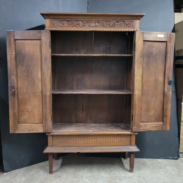 Early 20th century carved walnut French cabinet with 2 doors.