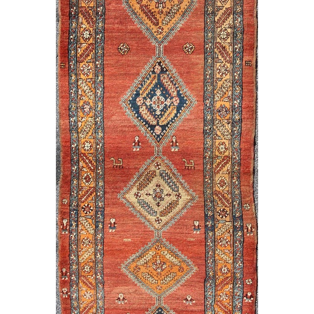 Measures: 3'6 x 11'6 Late 19th Century Antique Persian Bakshaish Rug with Tribal Medallions in Red. Keivan Woven Arts /...