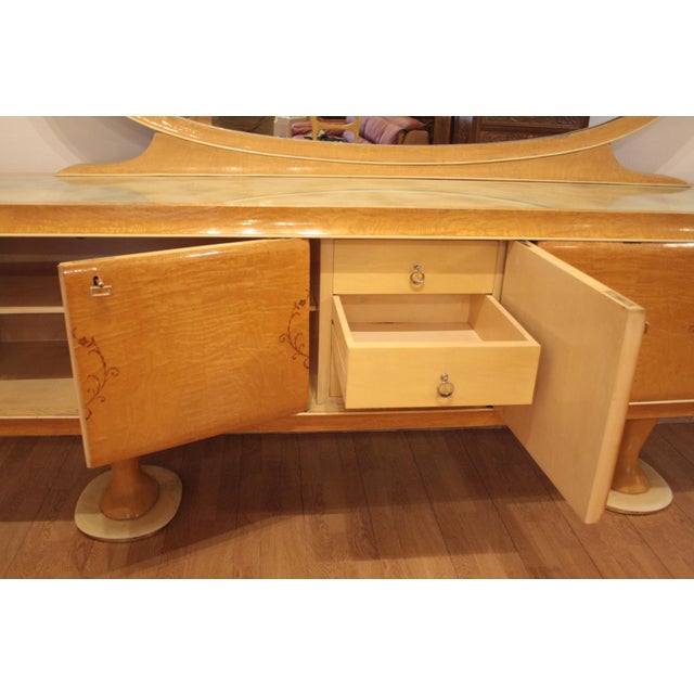 This sideboard was designed by the famous Italian designer Vittorio Dassi, Italy 1950. The piece of furniture is a very...