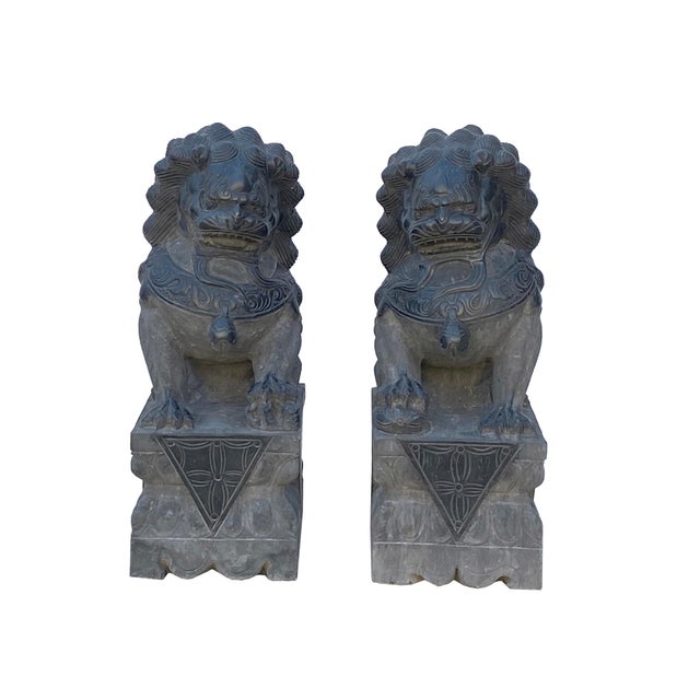 Elevate your property's aesthetic and spiritual harmony with this majestic pair of authentic hand-carved gray stone...