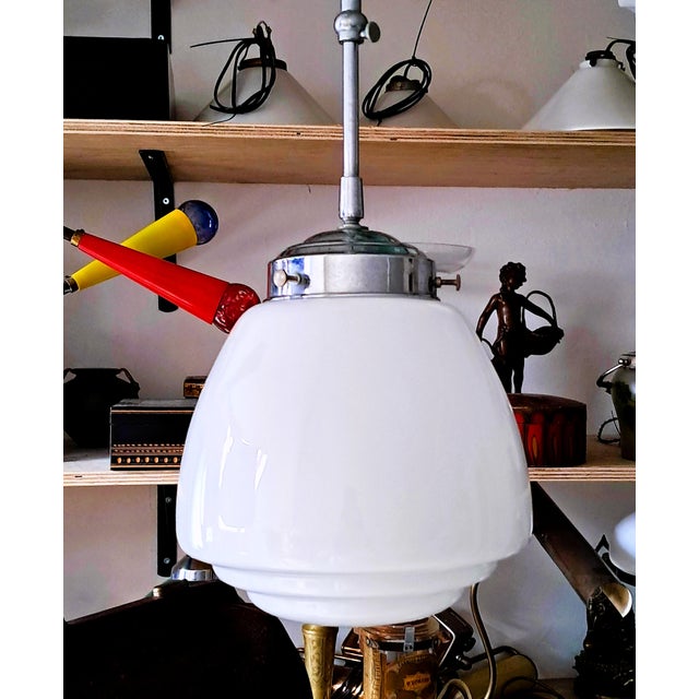 Height-adjustable opaline pendant light (82 - 100 cm), circa 1920–1940. Up to 250V (Europe/UK Standard).The wiring of this...
