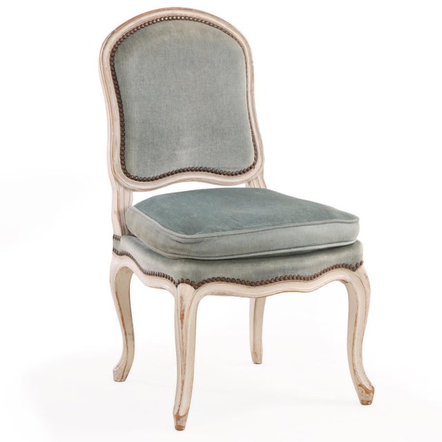 A distinguished set of eight French Louis XV-style side chairs dating to circa 1910, crafted with finely shaped and...