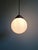 Art deco pendant light in white opaline glass with a copper-plated metal frame, produced by the belgian glassworks val...