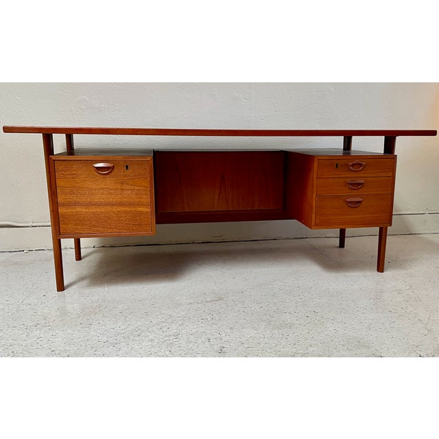 Beautiful Executive Desk with 3 Storage Drawers and a Hanging File Drawer, in the very recognizable style of Danish...