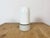 Vintage industrial ceiling or wall light made in former Czechoslivakia during the 1970s. It features a white porcelain...