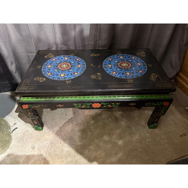 Elegant and eye-catching, this vintage Chinese coffee table beautifully combines artistry and function. The centerpiece of...